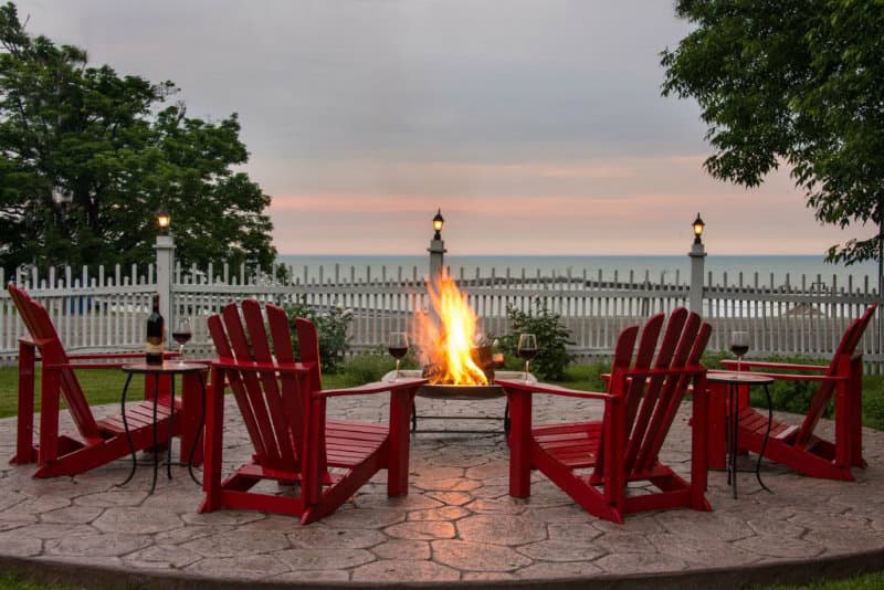 A bonfire with adirondack chairs overlooking Lake Michigan A bonfire with adirondack chairs overlooking Lake Michigan
